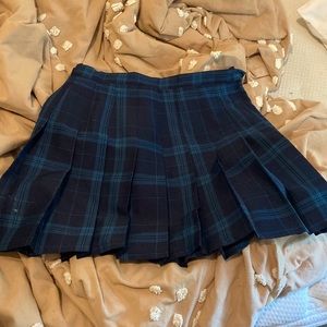 Unworn pleated, plaid mini skirt, size small.